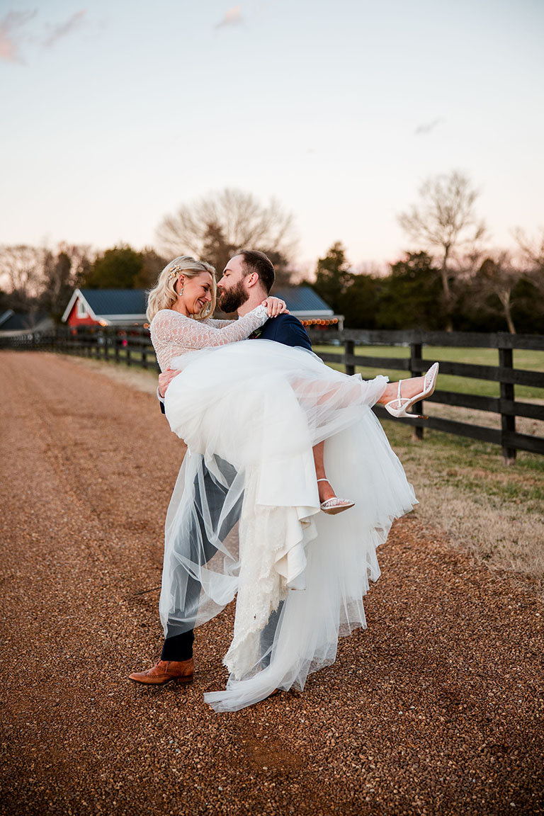 Groom Holding Bride