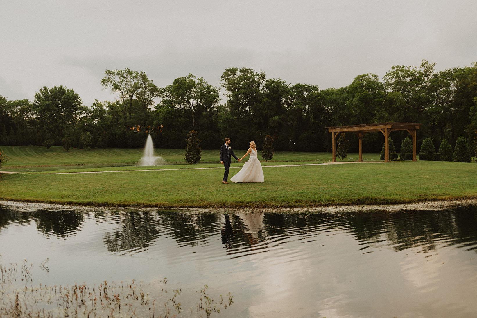 Caroline and Spencer Walking Outside at Sycamore Farms