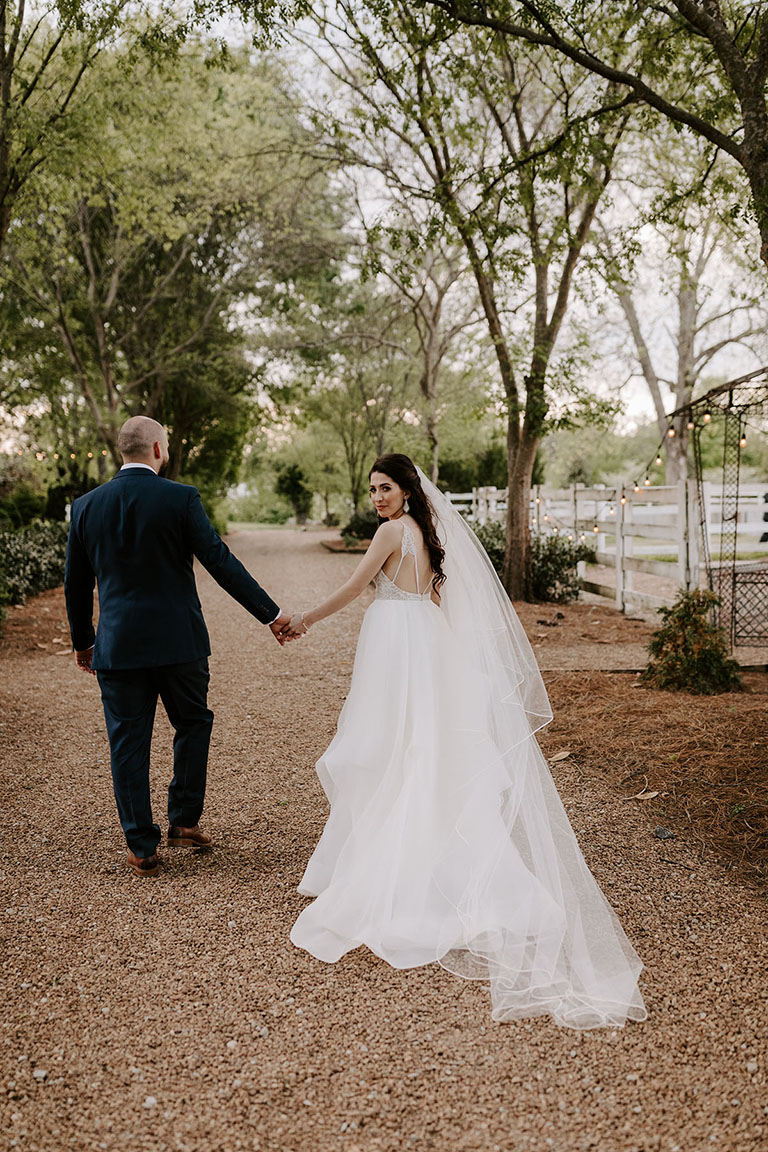 Bride and Groom Walking Holding Hands