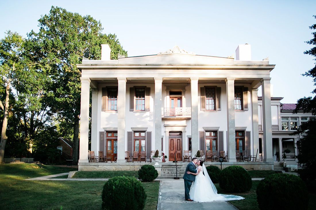 Laura + Matt Posing in Front of Mansion