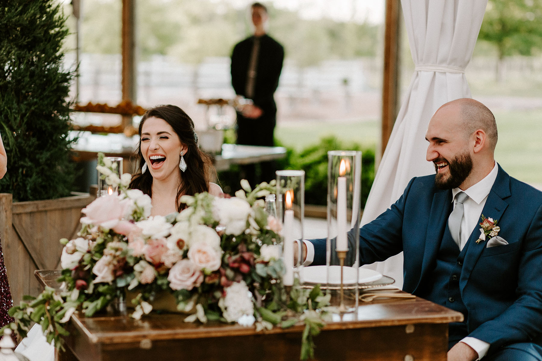 Kristen and Gabe Laughing at Wedding Reception