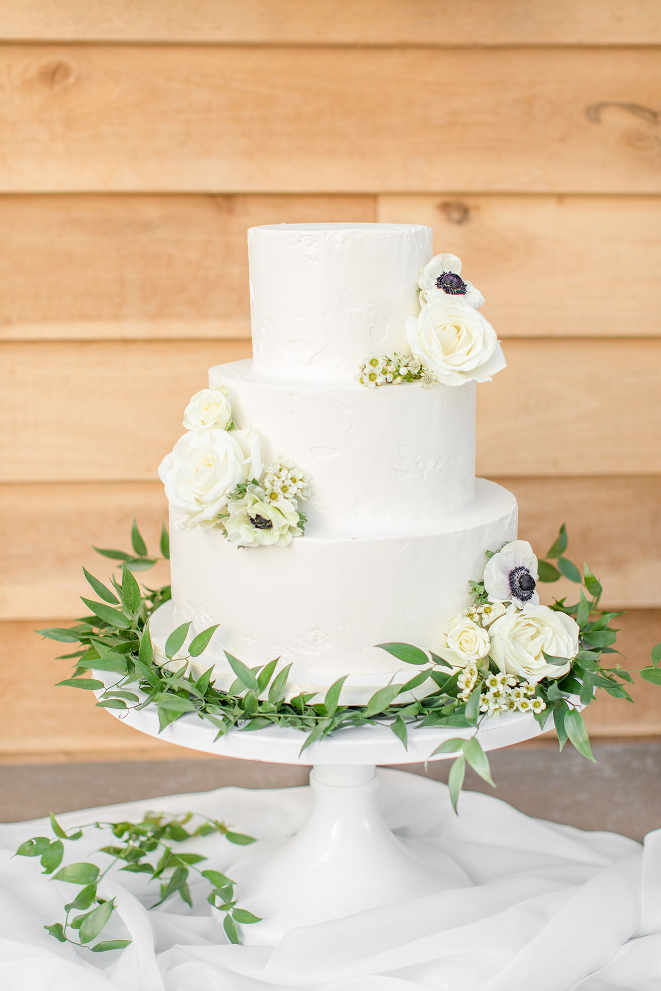 Three Tiered White Frosted Wedding Cake