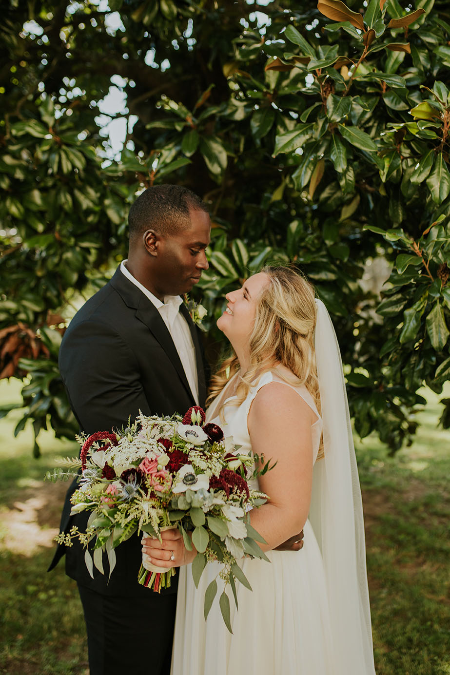 Bride and Groom Facing Each Other Smiling