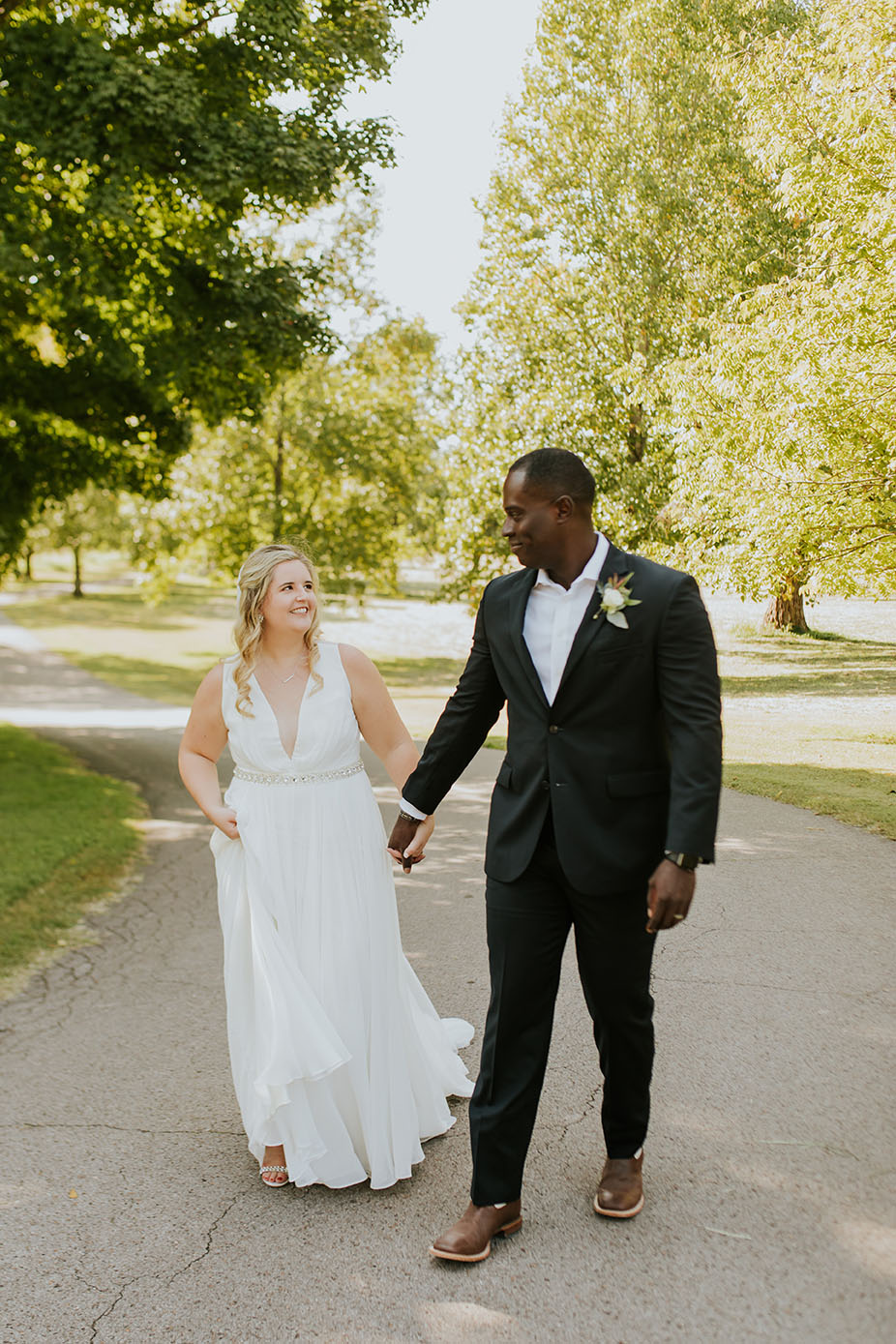 Bride and Groom Walking Holding Hands