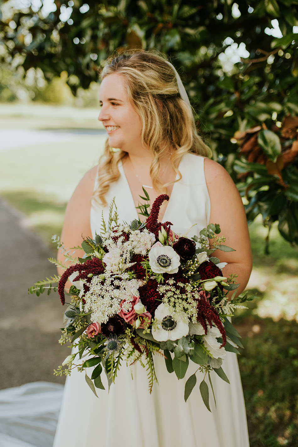 Bride Holding Bouquet At Outdoor Wedding