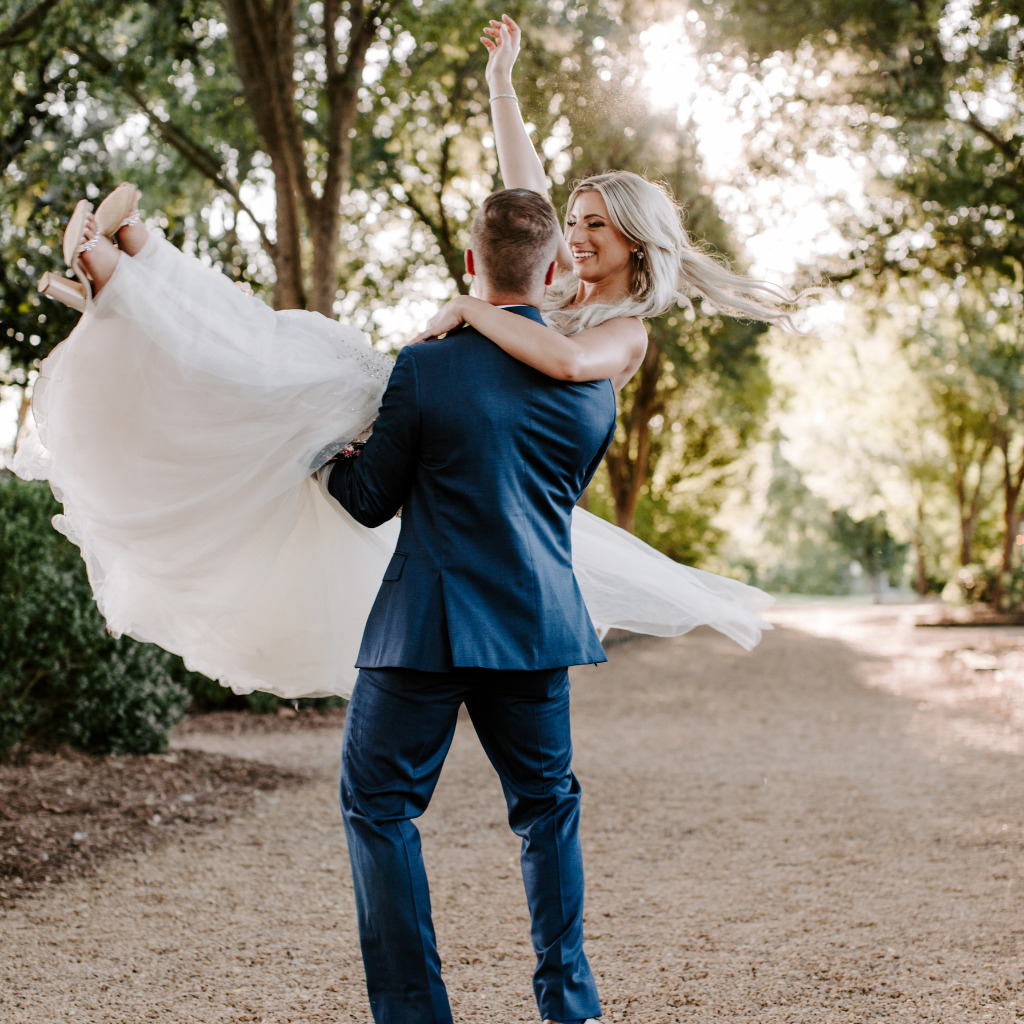 Groom Holding Bride In The Air