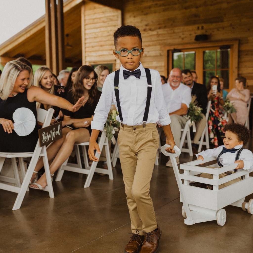 Ring Bearer Pulling A Wagon With Boy