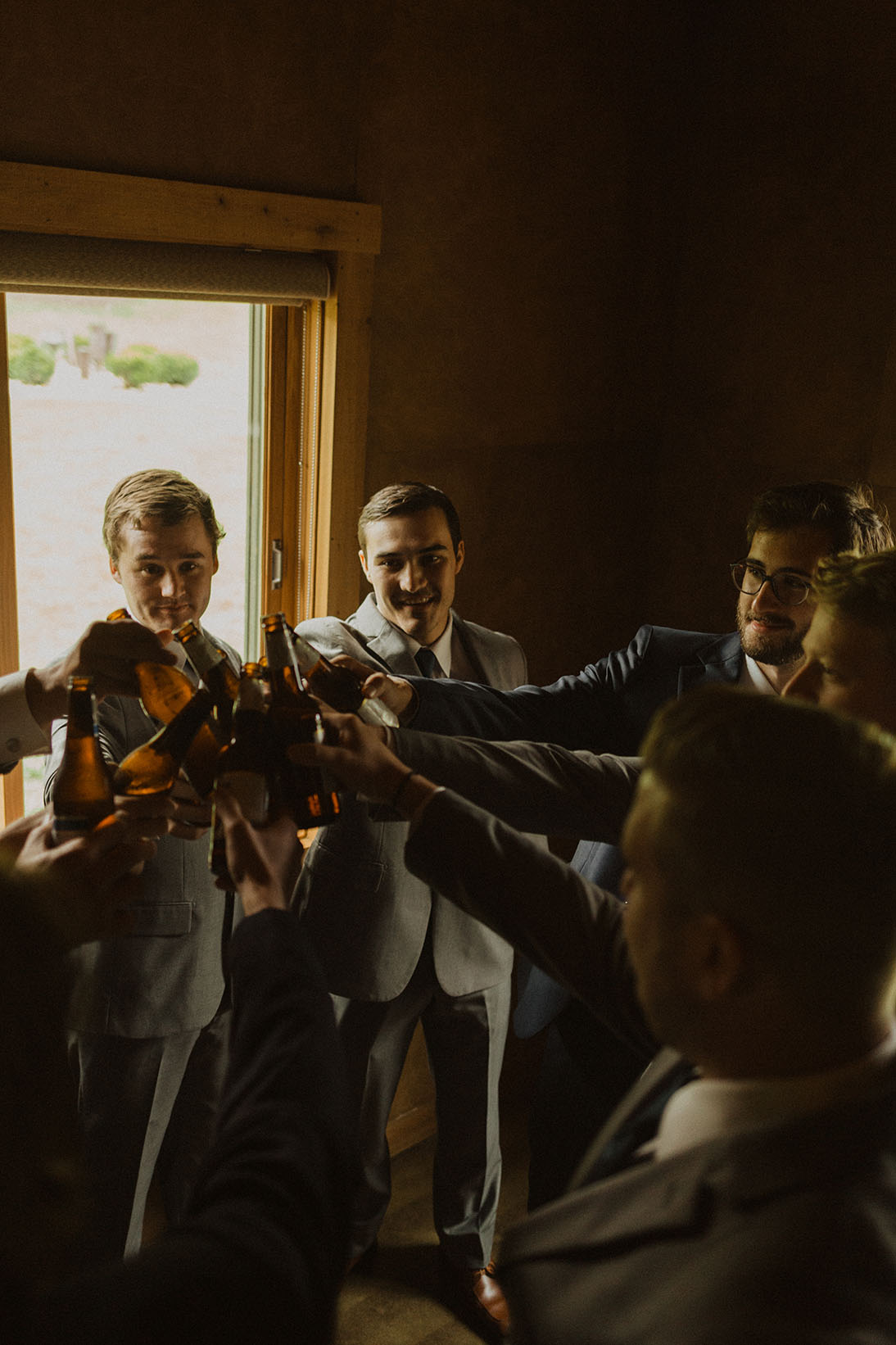 Groom and Groomsmen Toasting with a Beer