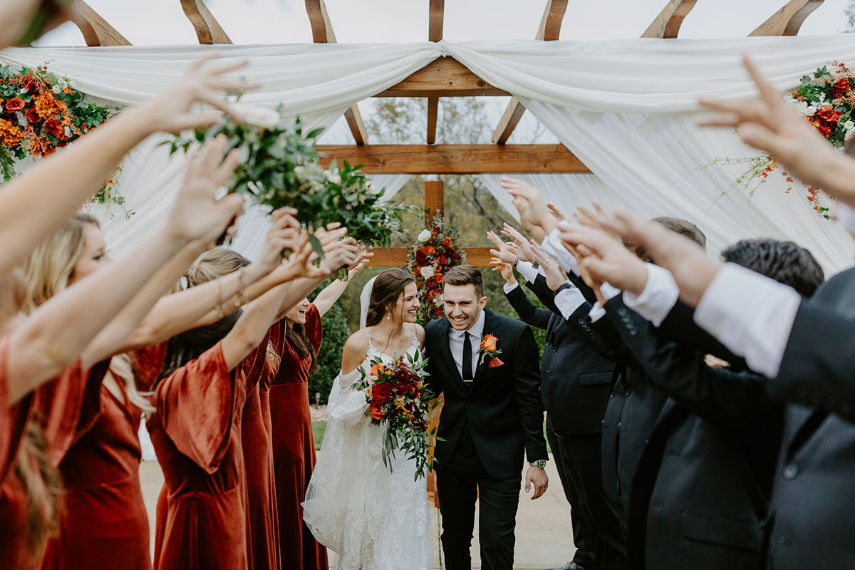 Bride And Groom Posing After Their Outdoor Wedding Ceremony