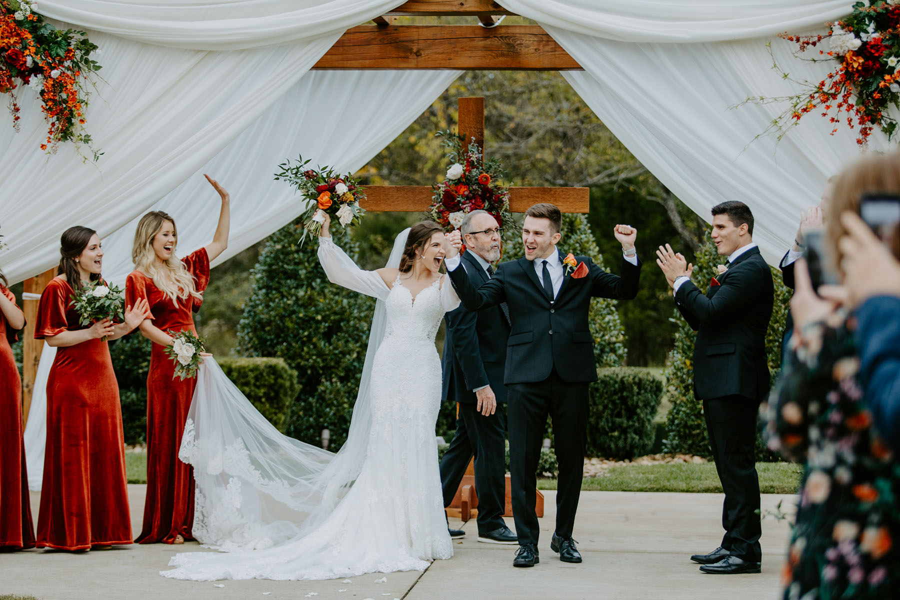 Bride And Groom Posing After Their Outdoor Wedding Ceremony