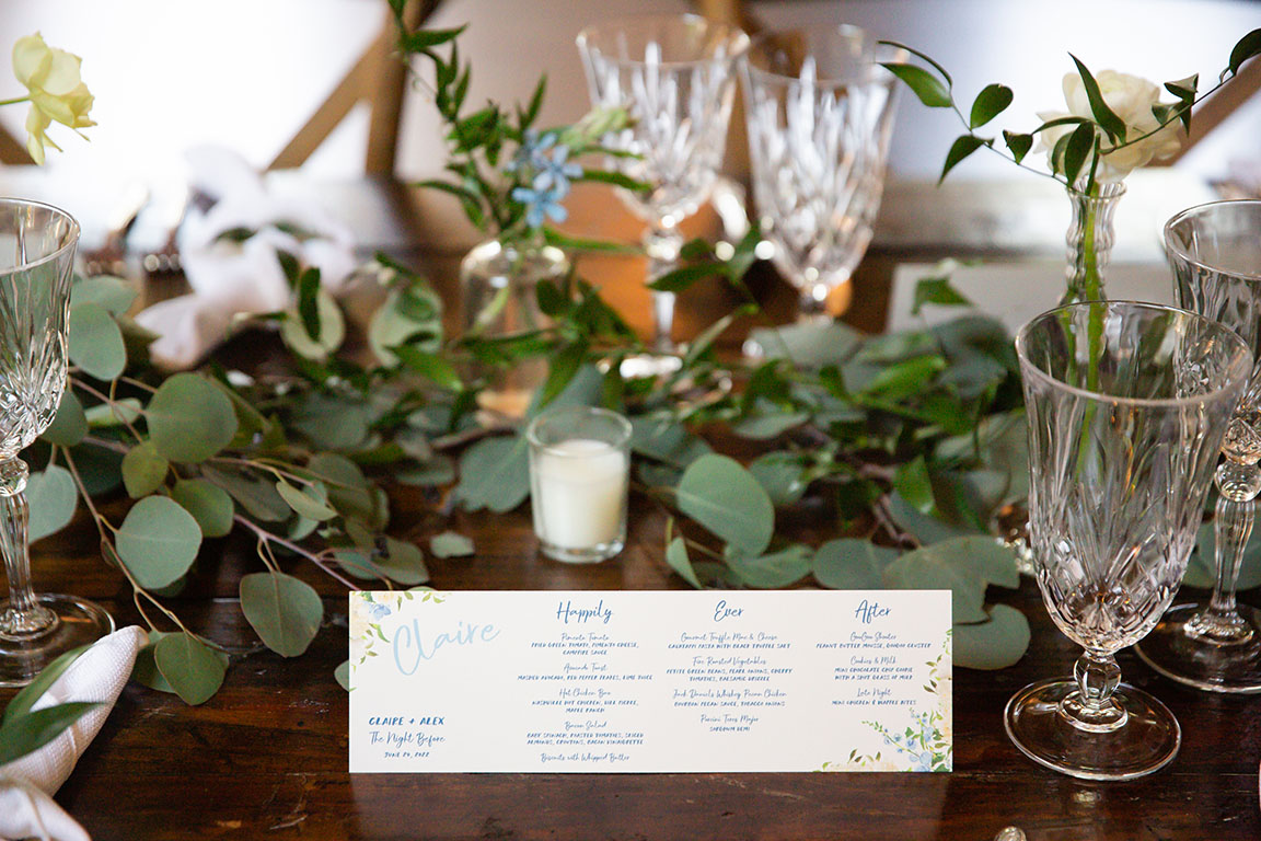 rehearsal dinner tablescape with custom menu cards