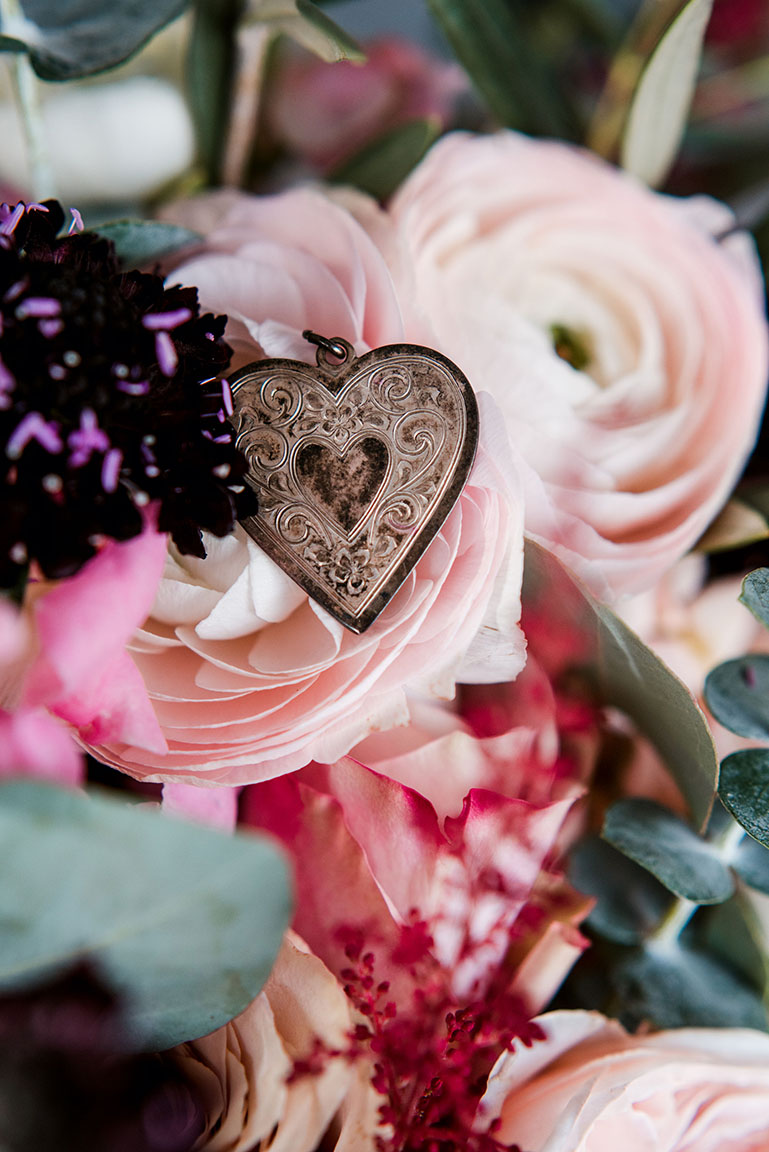 Heart Locket Sitting on Pink Flowers