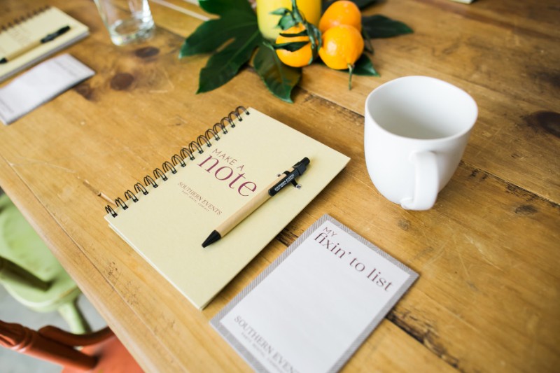 Notepads On Desk With Pen And Coffee Mug