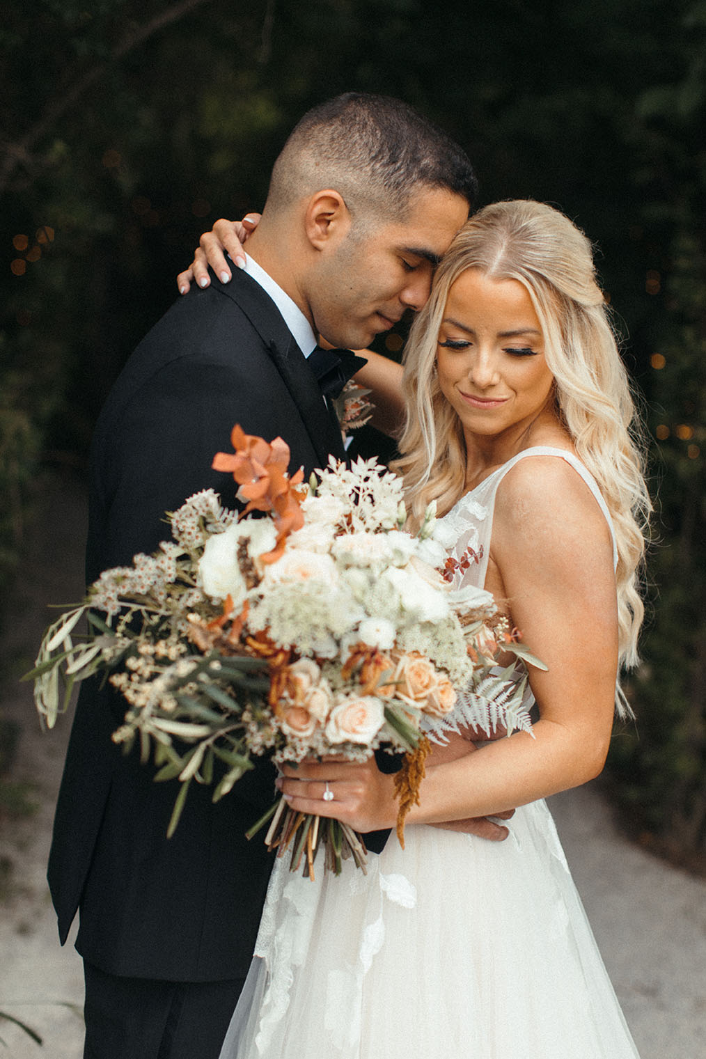 Close up of Bride and Groom with Bouquet