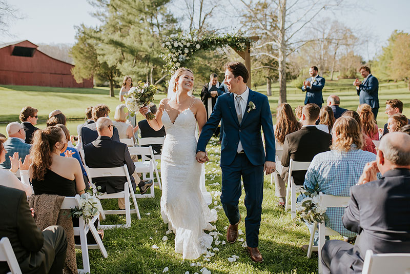 Bride and groom leaving ceremony site