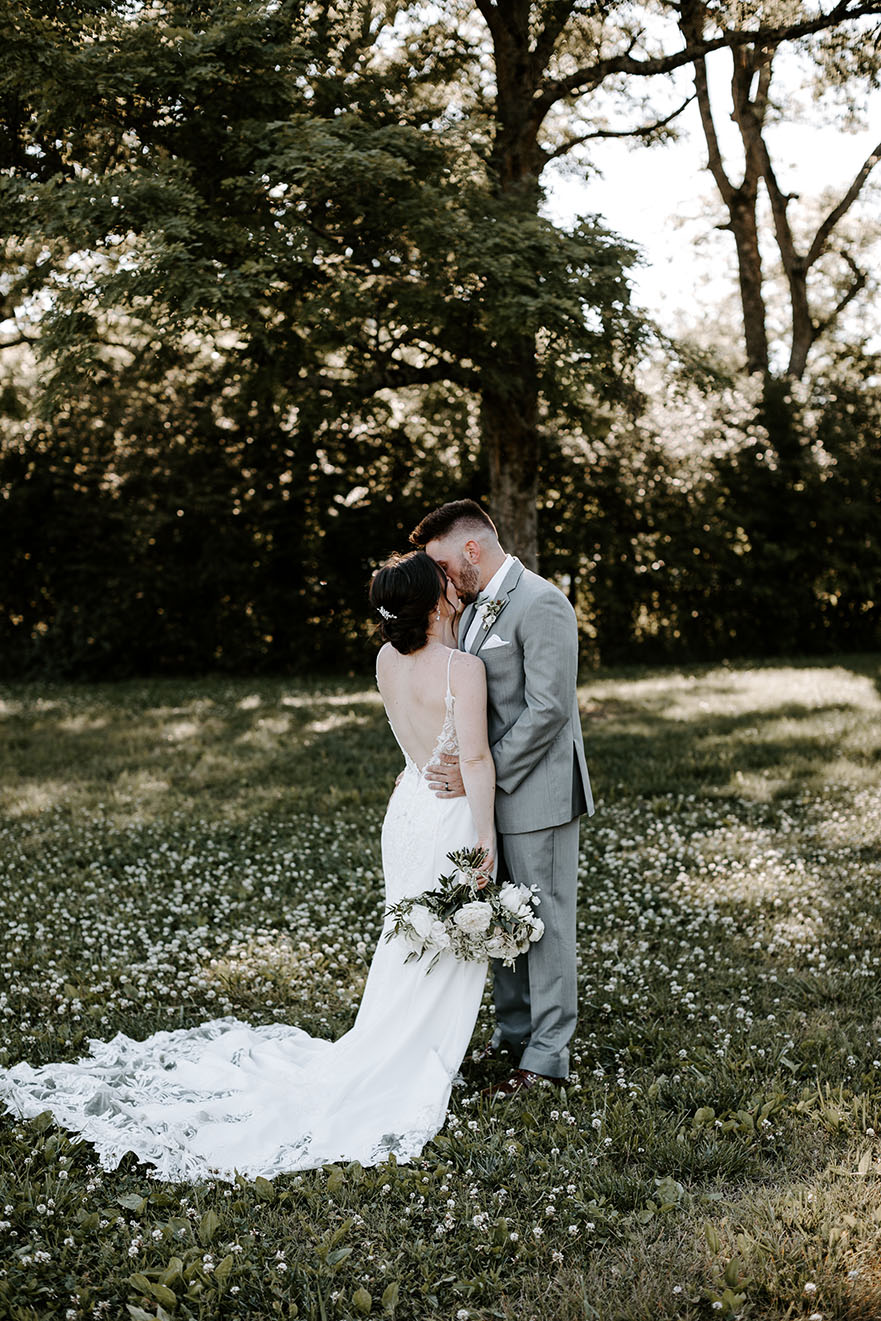 bride and groom kissing after ceremony