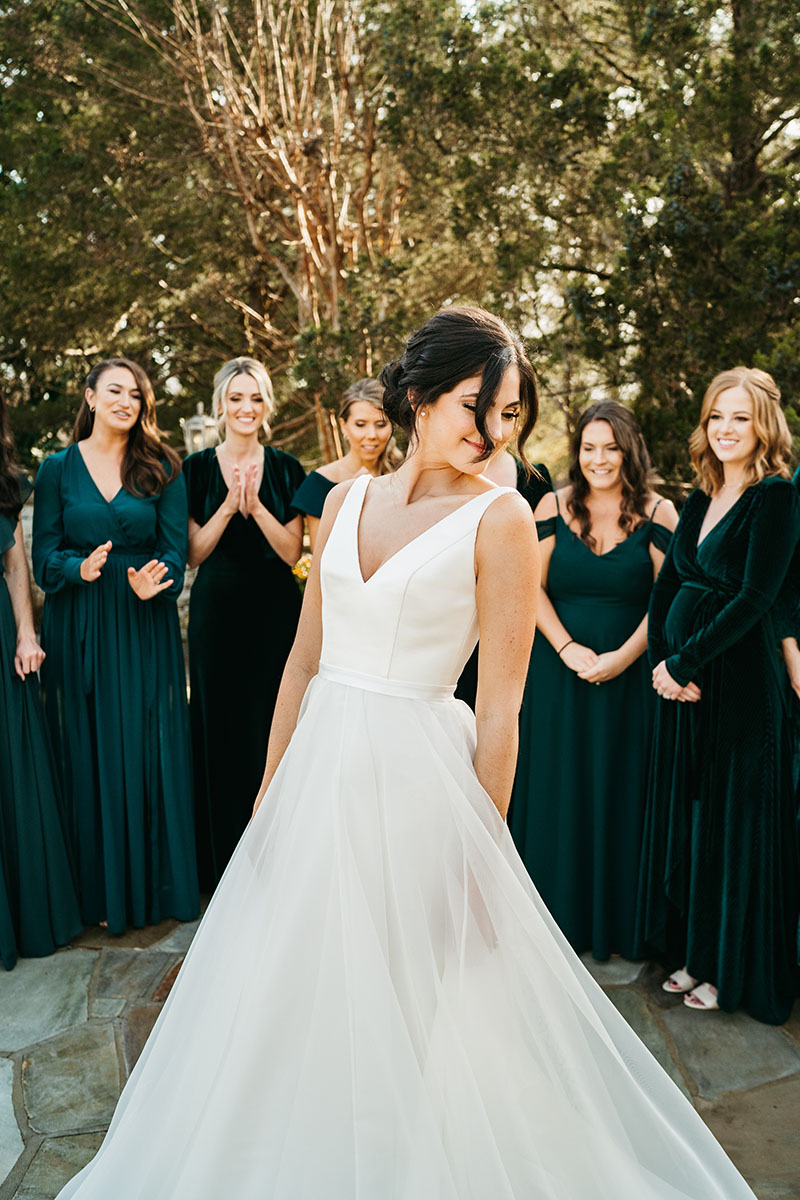 bride doing a first look with her bridemaids