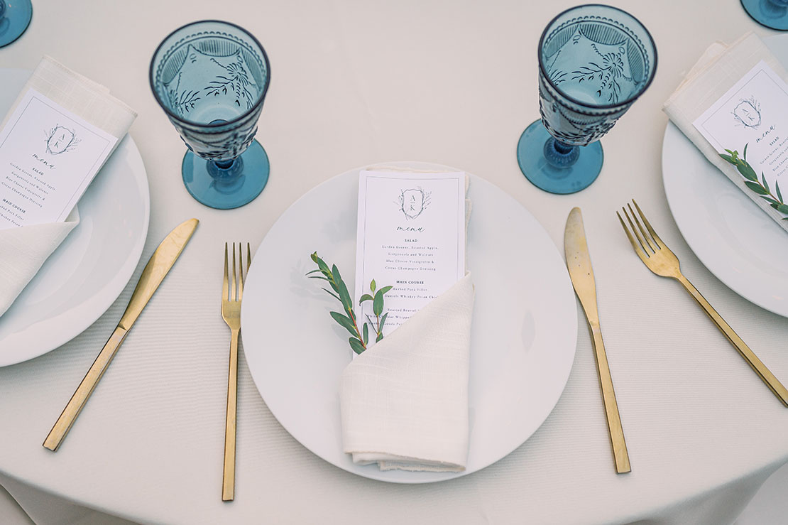 wedding menu with blue and gold accents