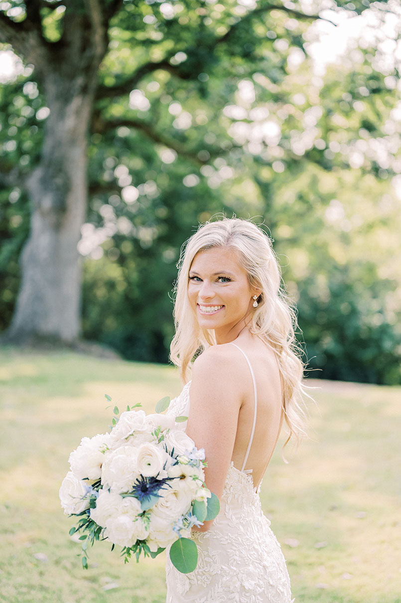 bride portraits with classic bouquet with pops of blue