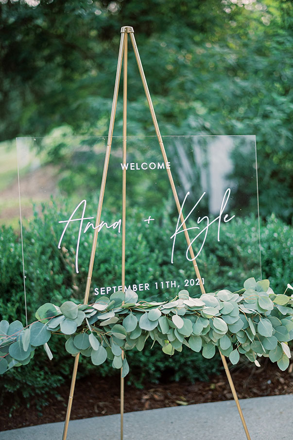 wedding welcome sign with greenery