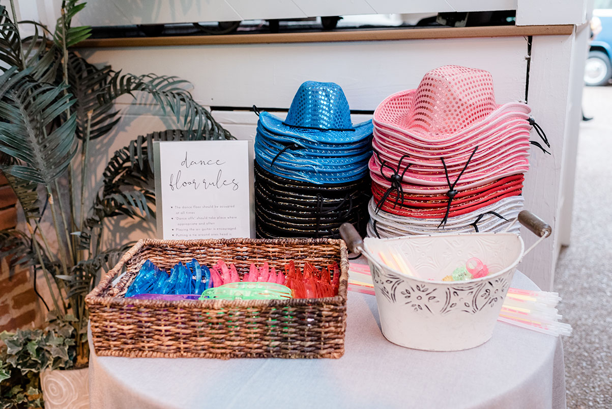 wedding cowboy hats, sunglasses and glowsticks