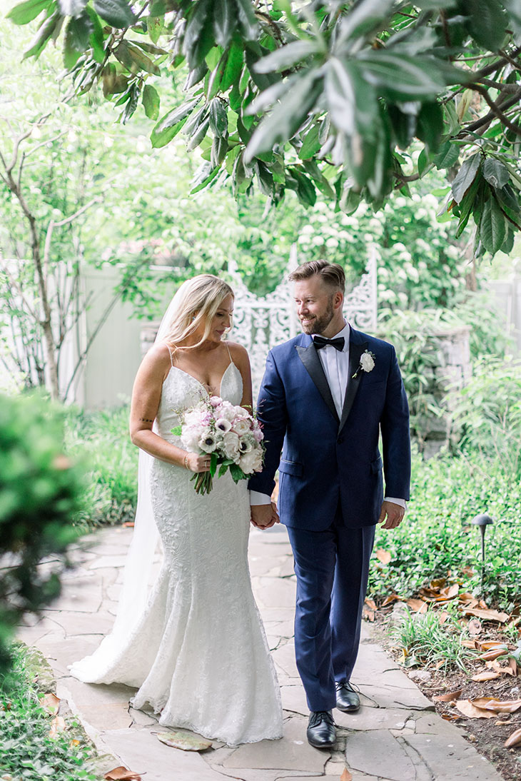 bride and groom walking hand in hand