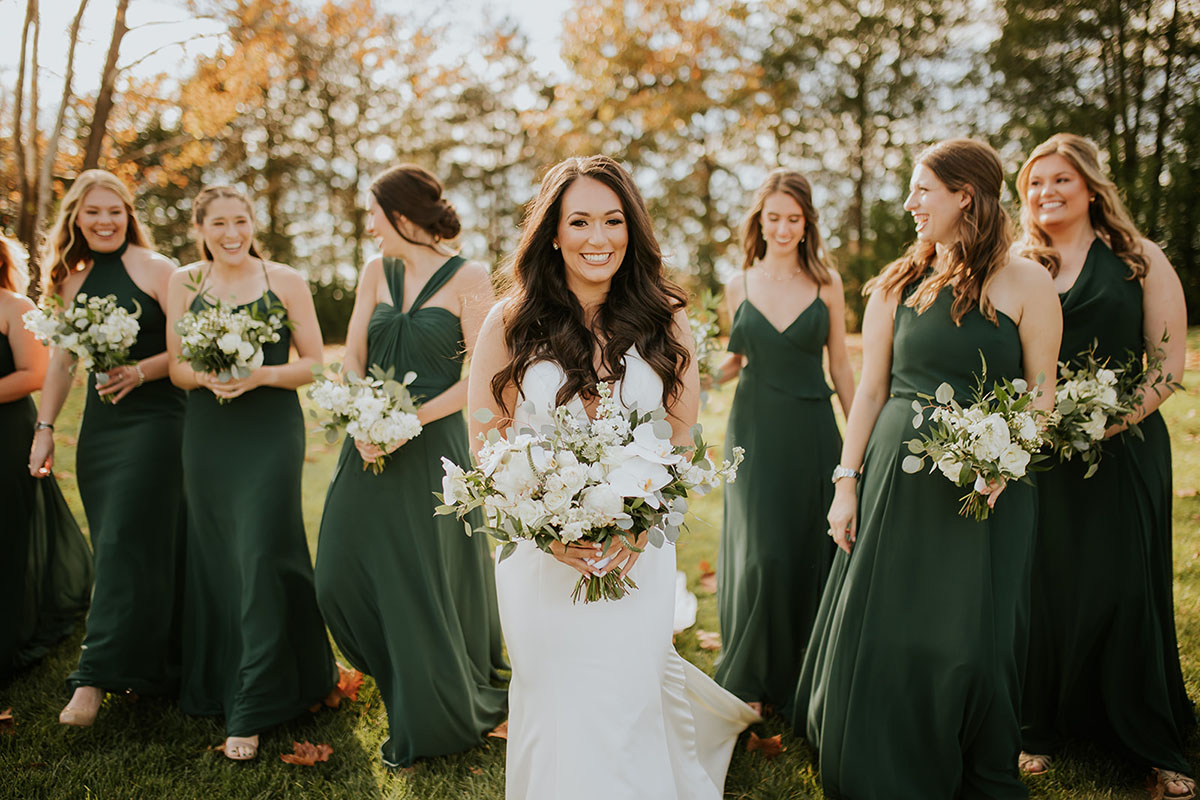 bride and bridesmaids in emerald green dresses