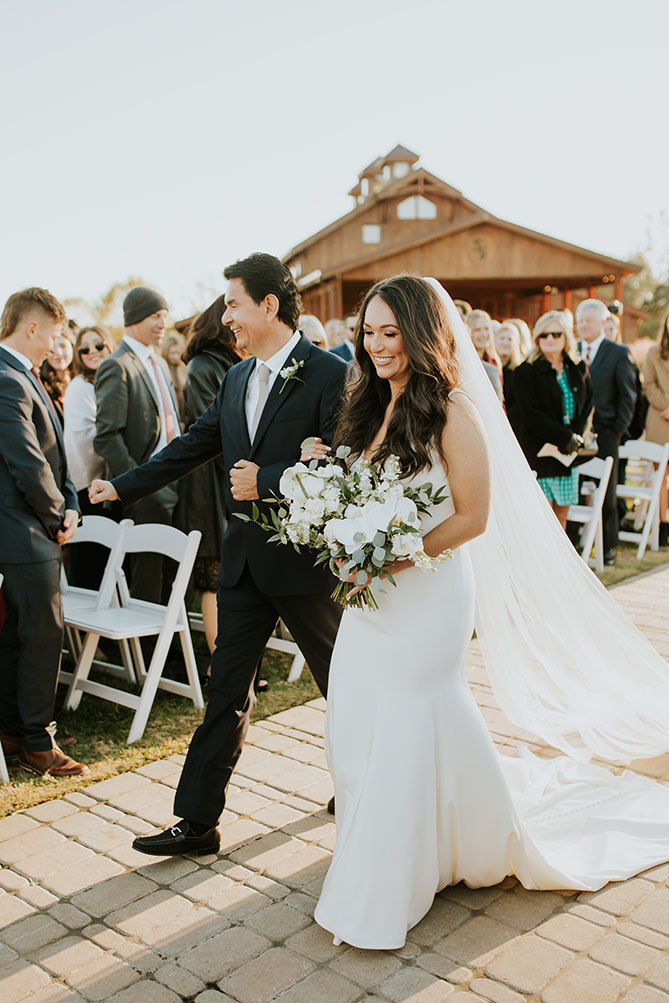 bride and father walking down aisle