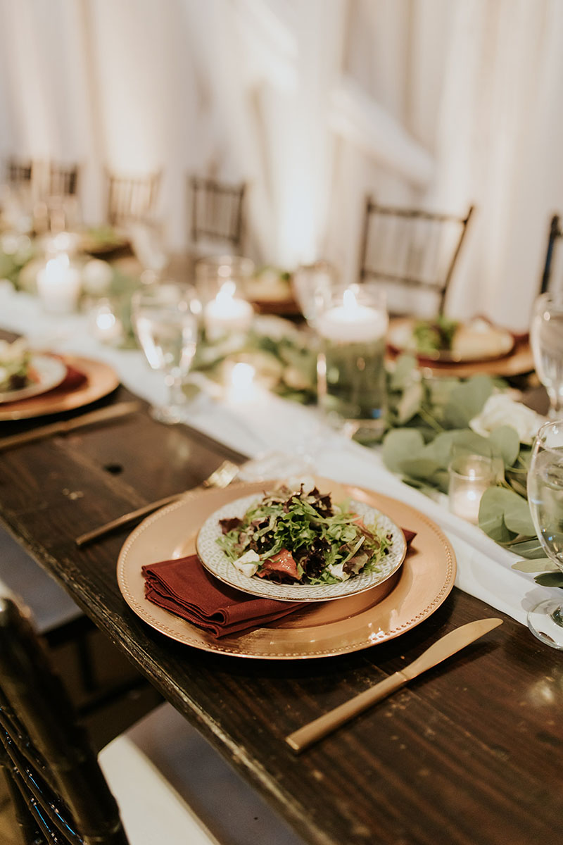 plated wedding salad with greenery centerpieces