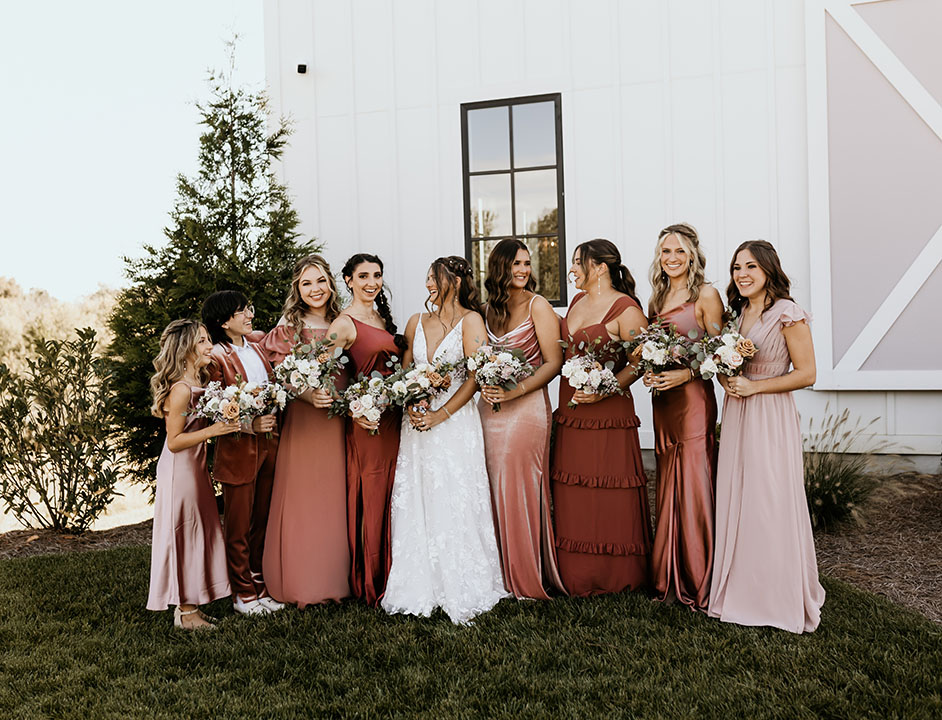 bride and bridemaids wearing mix and match blush bridemaid dresses