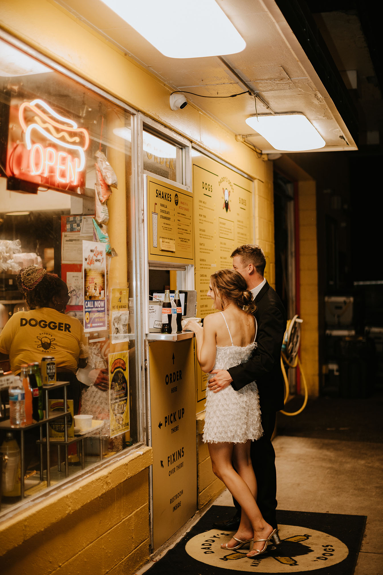 Newlyweds order hot dogs after their wedding reception at Daddy's Dogs in Nashville