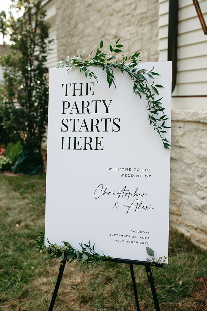 wedding welcome sign with greenery