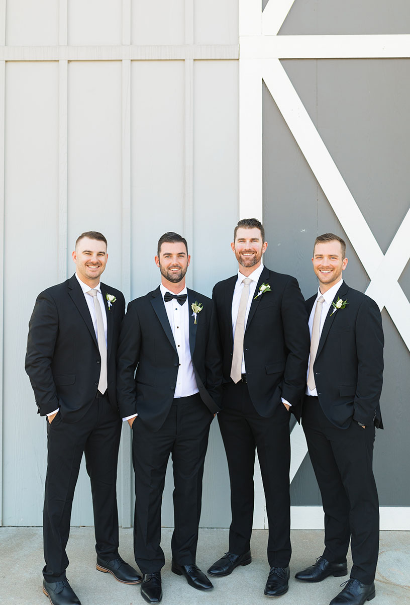 groom and groomsmen in classic black tuxedos