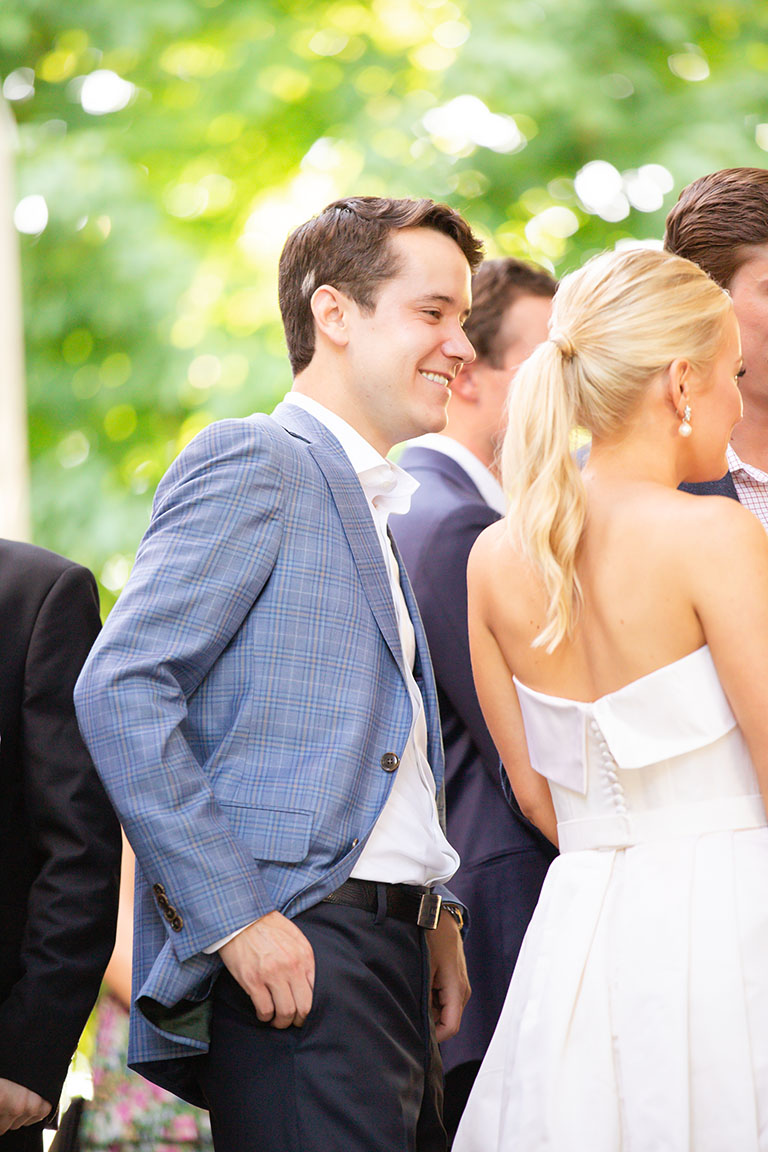 Groom- and bride-to-be mingling with guests at rehearsal dinner