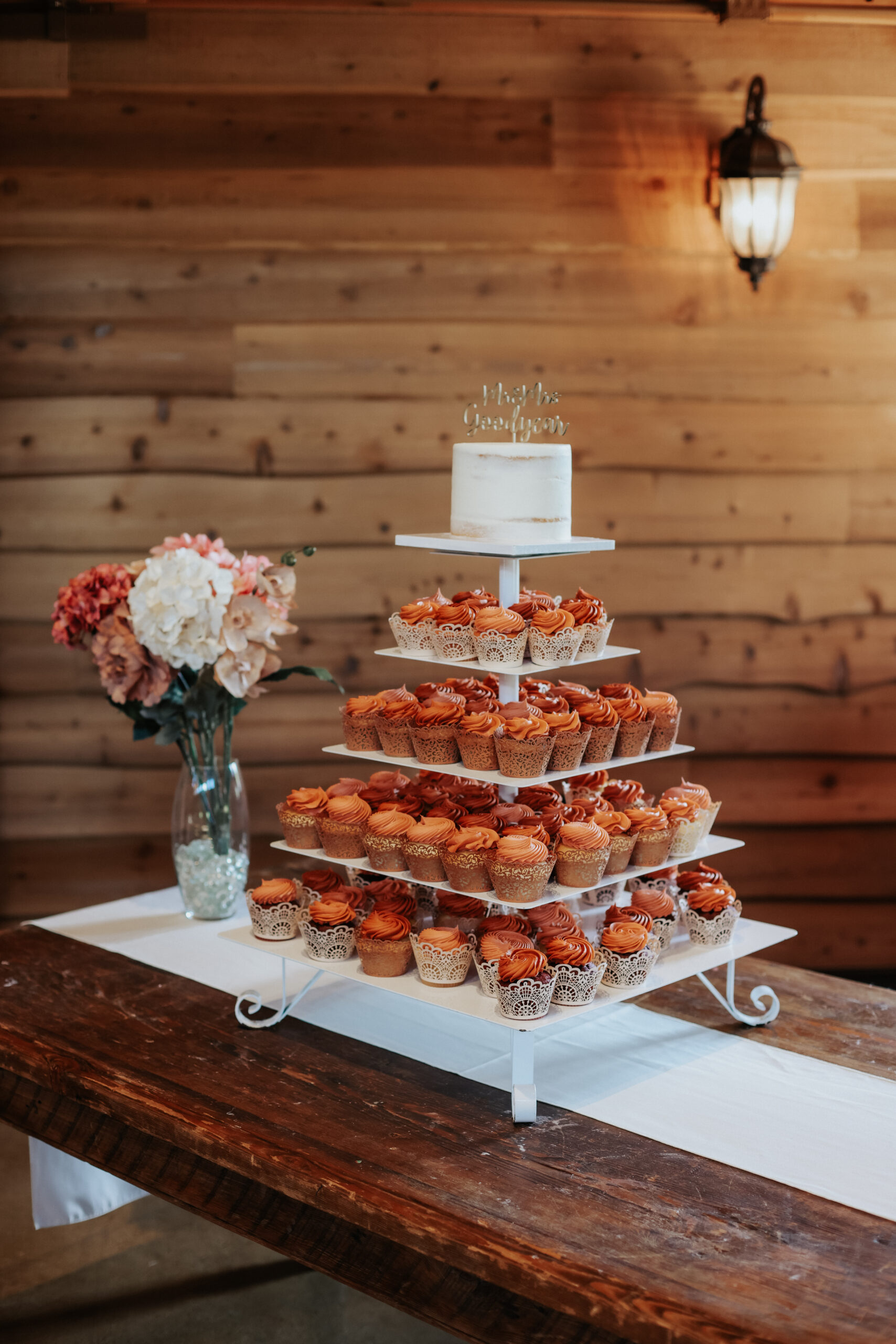 A cupcake tower of orange cupcakes