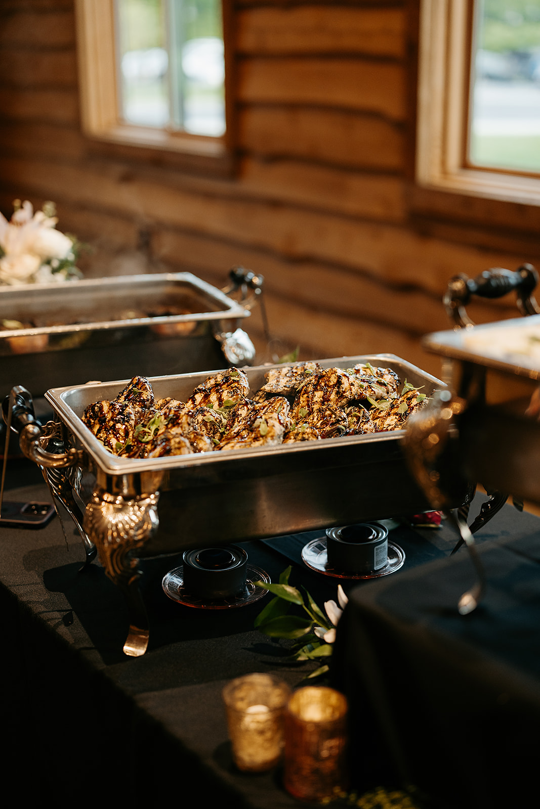 honey balsamic chicken in a chafing dish set up on a buffet table