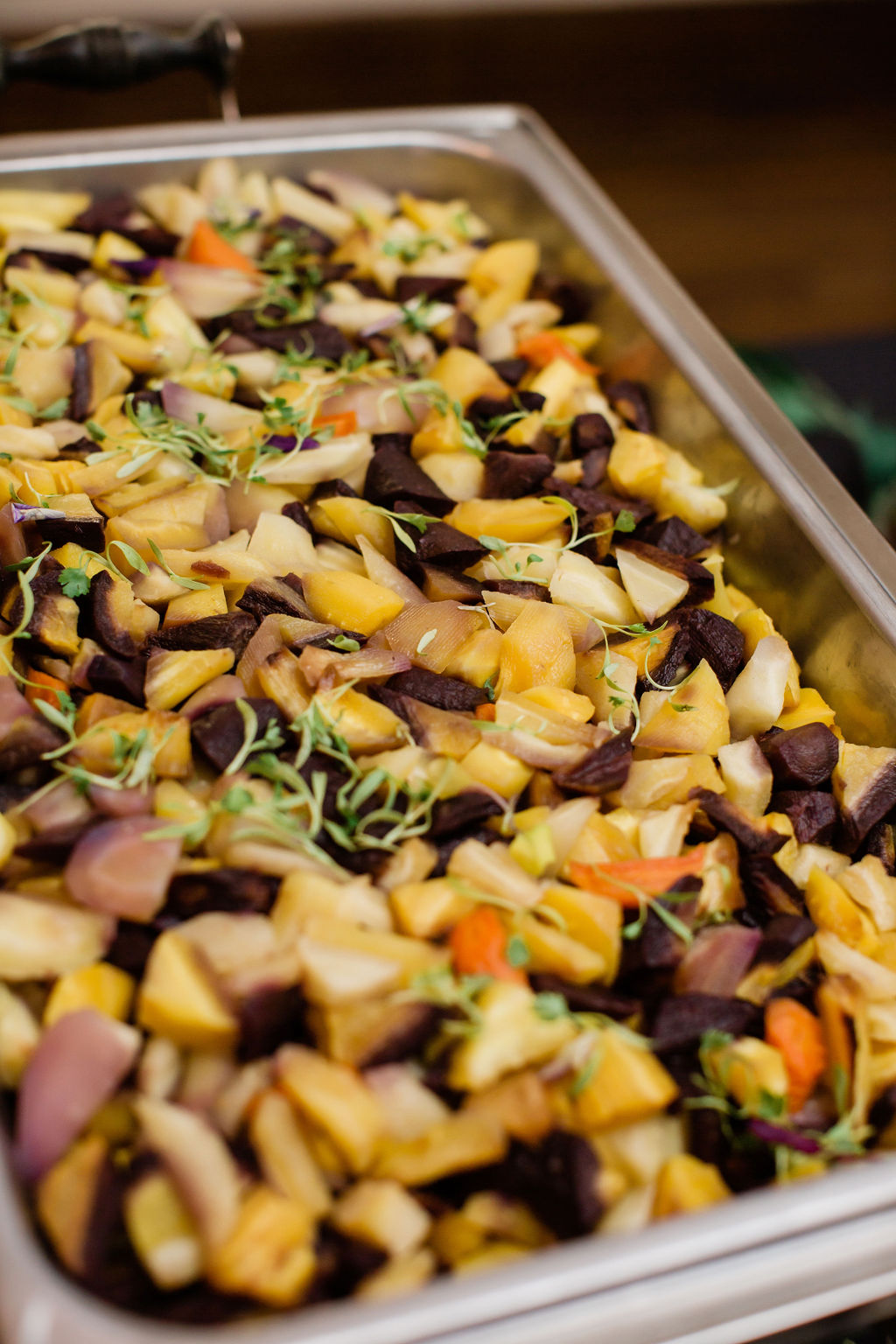 Sage and brown butter carrots in a buffet chafing dish